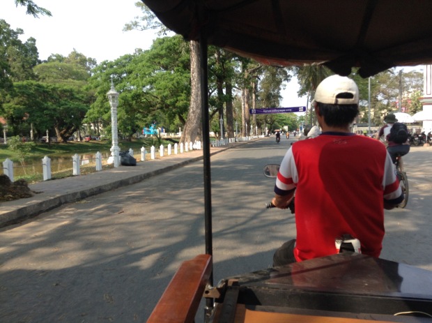 Take a tuk-tuk from Siem Reap to Angkor Park at least once.